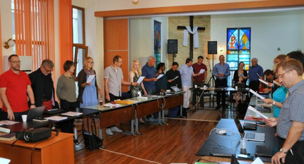 Participants in the European Methodist Council’s September meeting in Ruse, Bulgaria, during devotions. Much of the meeting was devoted to a discussion of the current refugee crisis in Europe. Photo by Üllas Tankler, UMNS