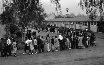 People line up for lunch at Santa Anita Park in April 1942. The park, a converted racetrack, was the United States’ largest assembly center for Japanese Americans on their way to internment camps. Photo courtesy of Creative Commons/National Archives and Records Administration